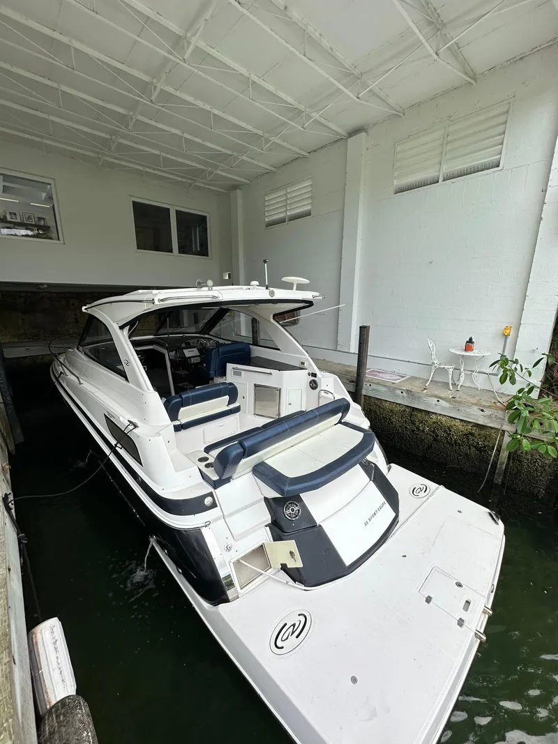 Slide: The Image of 2014 Regal 35 Sport Coupe docked in covered marina, rear view. - 2