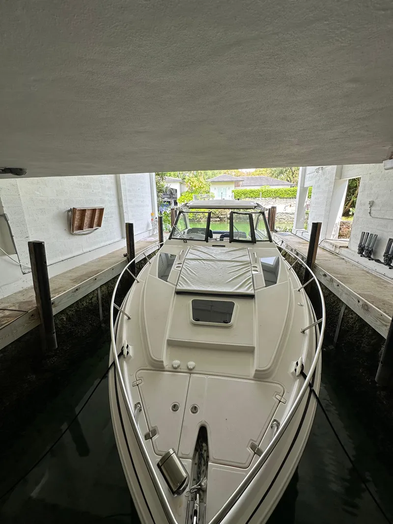 Slide: The Image of 2014 Regal 35 Sport Coupe docked in a covered marina. - 4