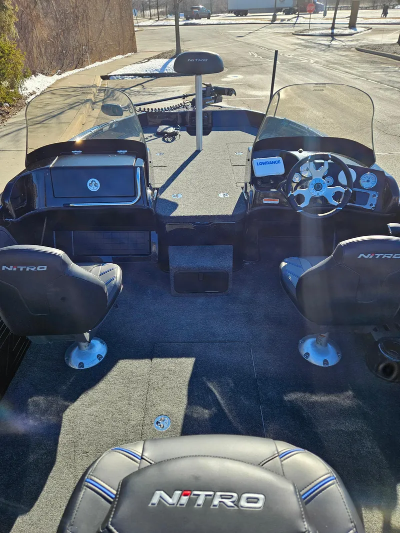 Slide: The Image of 2025 Nitro ZV19 boat interior with dual consoles and steering wheel. - 3