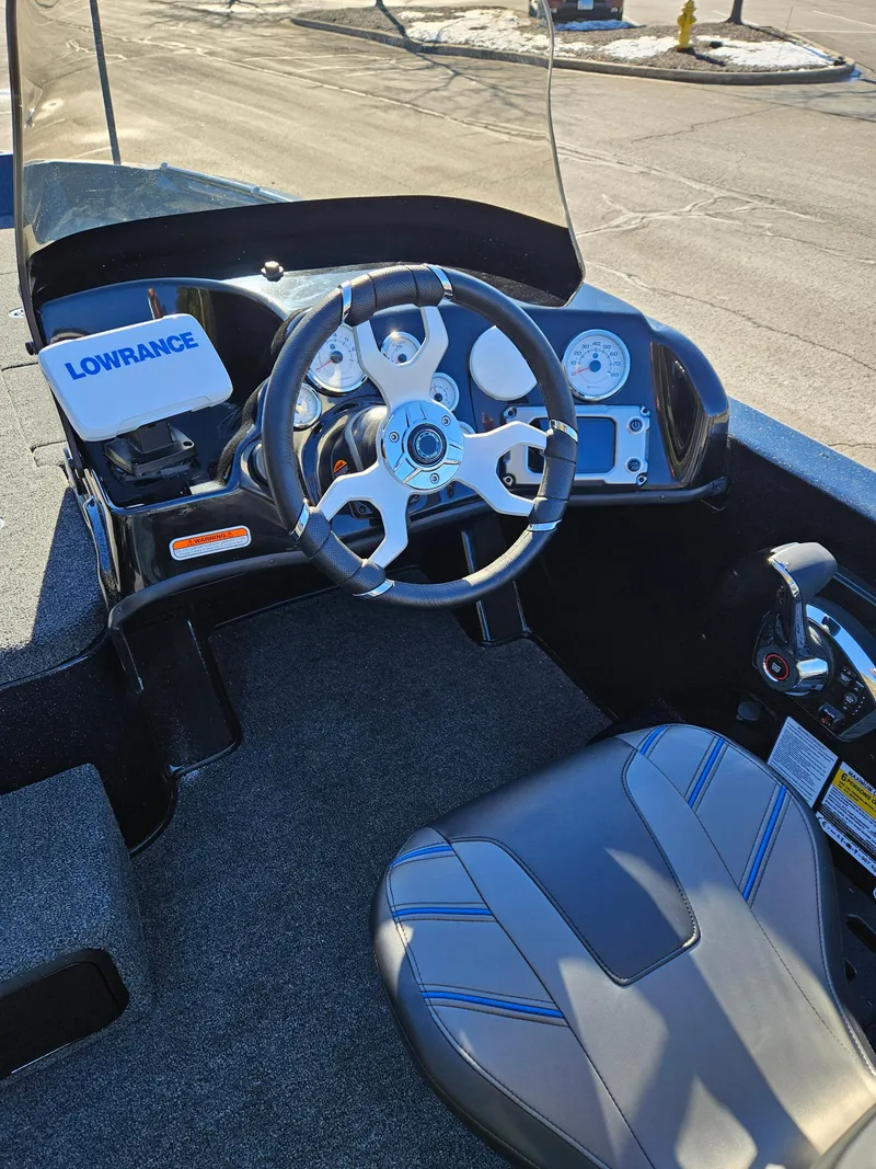 Slide: The Image of 2025 Nitro ZV19 boat cockpit with steering wheel and Lowrance navigation system. - 4