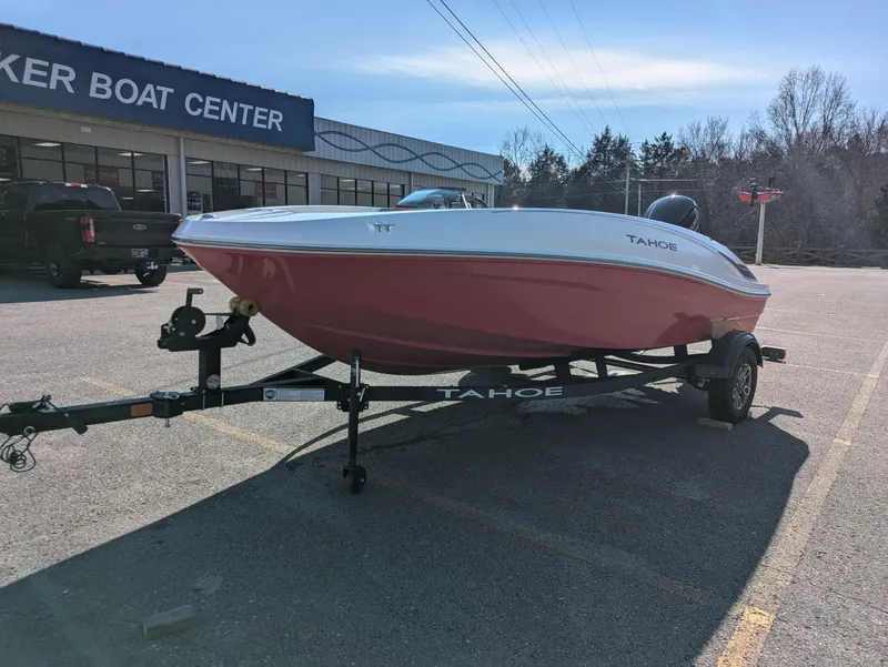 Slide: The Image of 2025 Tahoe T16 boat on trailer at dealer lot, sunny day. - 3