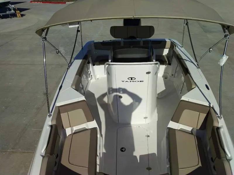 Slide: The Image of 2025 Tahoe 2150 CC boat interior with seating and canopy. - 7