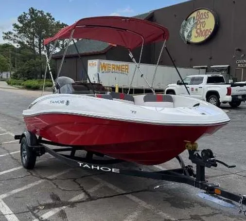Slide: The Image of 2025 Tahoe T16 boat with red canopy on trailer outside Bass Pro Shops. - 3