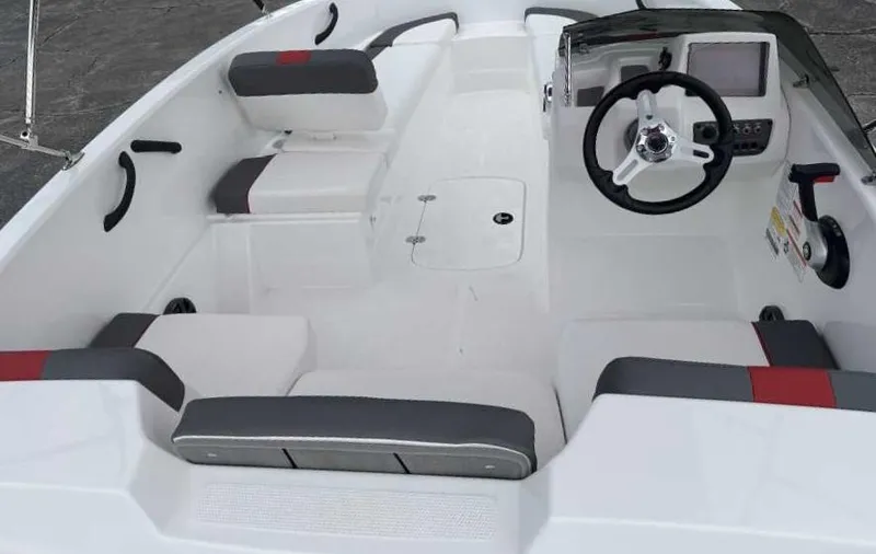 Slide: The Image of 2025 Tahoe T16 boat interior with modern steering and seating. - 32
