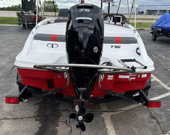 Slide: The Image of 2025 Tahoe T16 boat with Mercury 75 engine, parked on pavement. - 6