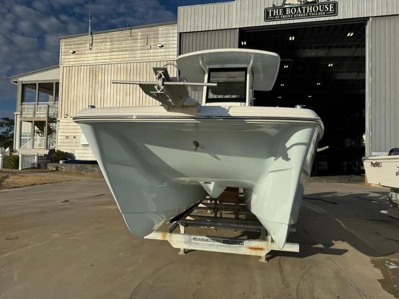 Slide: The Image of 2022 World Cat 235 CC boat on trailer outside The Boathouse. - 16
