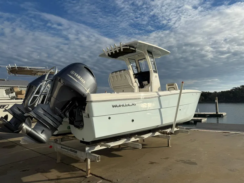 Slide: The Image of 2022 World Cat 235 CC boat with Yamaha engines on a dock. - 3
