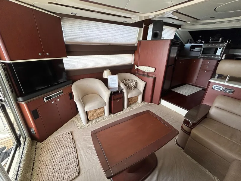Slide: The Image of Luxurious interior of 2013 Meridian 441 yacht with modern furnishings and entertainment area. - 14