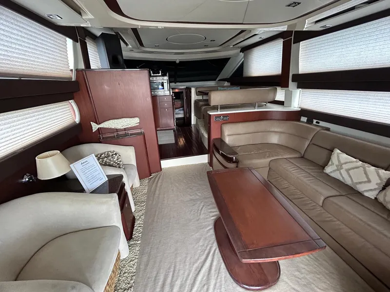 Slide: The Image of Luxurious interior of a 2013 Meridian 441 yacht with elegant seating and wooden accents. - 15