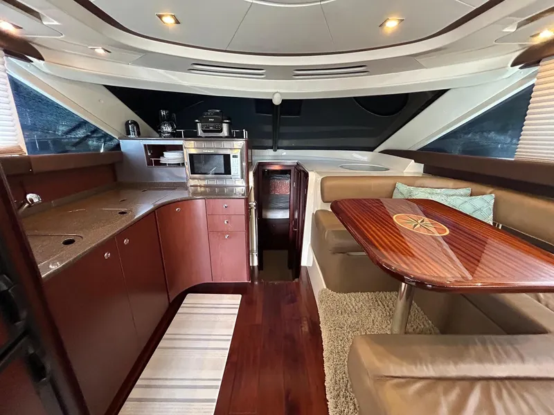 Slide: The Image of Luxurious interior of 2013 Meridian 441 yacht with modern kitchen and dining area. - 16