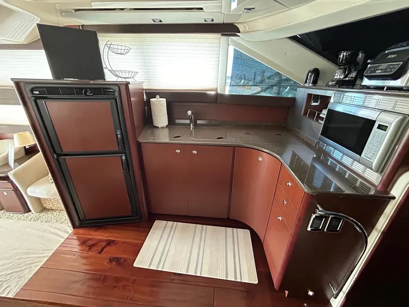 Slide: The Image of Luxurious 2013 Meridian 441 yacht kitchen with modern appliances and sleek cabinetry. - 18