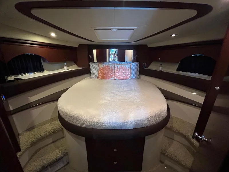 Slide: The Image of Luxurious 2013 Meridian 441 yacht bedroom with elegant bedding and ambient lighting. - 21