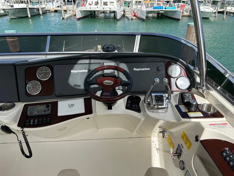 Slide: The Image of 2013 Meridian 441 yacht helm with Raymarine electronics, docked in marina. - 5
