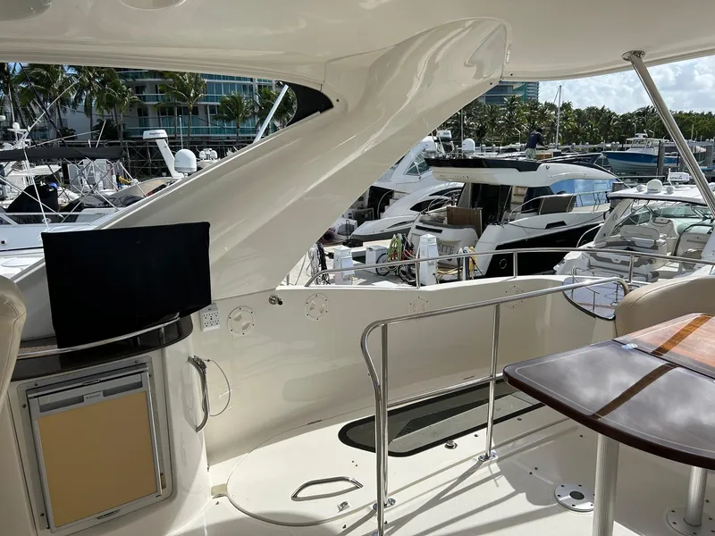 Slide: The Image of 2013 Meridian 441 yacht interior with marina view, featuring sleek design and modern amenities. - 7