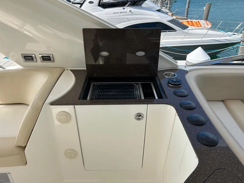 Slide: The Image of Outdoor kitchen area on 2013 Meridian 441 yacht with grill and seating. - 8
