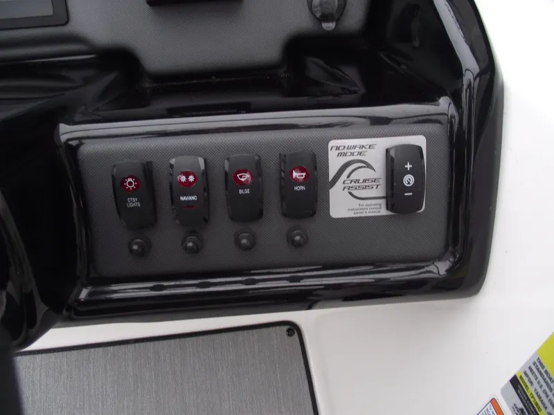 Slide: The Image of Control panel of 2021 Yamaha Boats AR195 with various switches and cruise assist feature. - 20