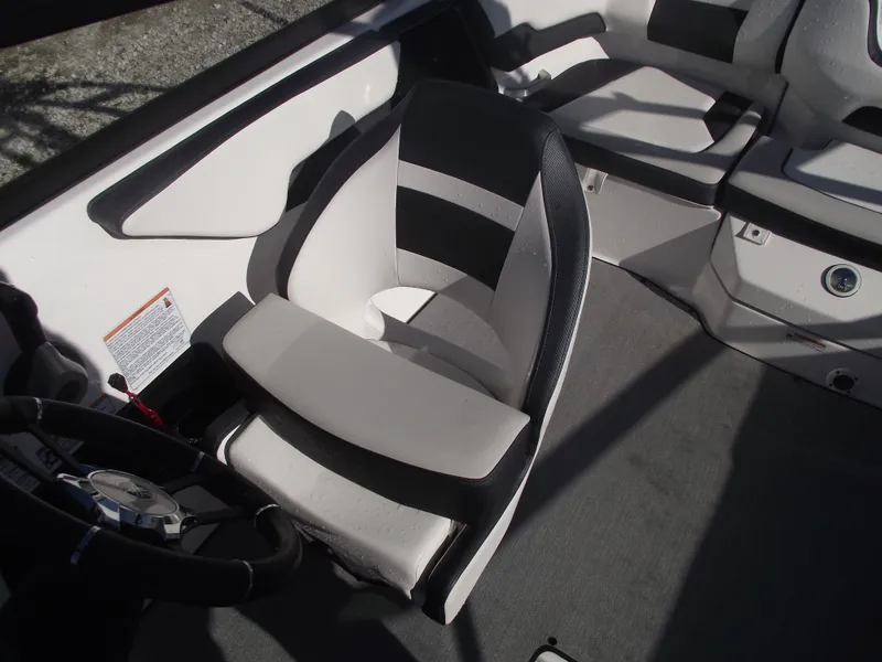Slide: The Image of 2021 Yamaha AR195 boat interior with sleek seating and steering wheel. - 22