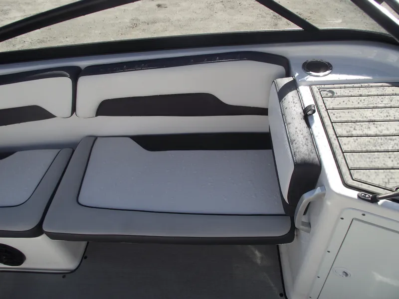 Slide: The Image of 2021 Yamaha AR195 boat interior with cushioned seating and sleek design. - 23