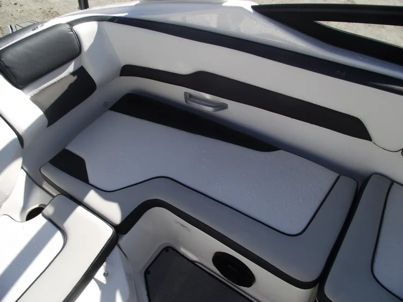 Slide: The Image of 2021 Yamaha AR195 boat interior seating with sleek black and white design. - 28