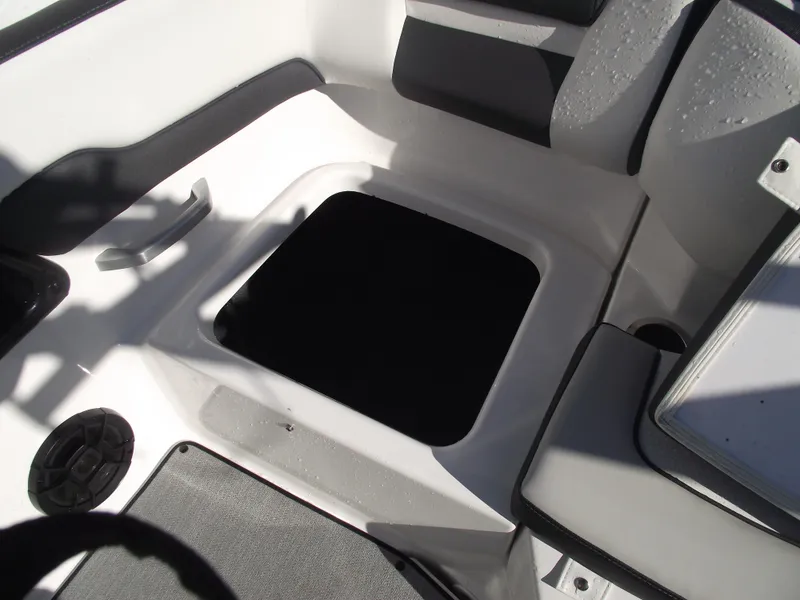 Slide: The Image of Interior view of 2021 Yamaha AR195 boat showing seating and storage compartment. - 32