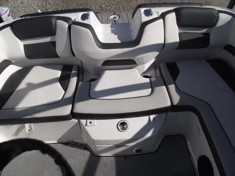 Slide: The Image of 2021 Yamaha AR195 boat interior with cushioned seating and storage compartments. - 33