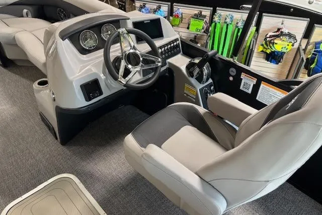 Slide: The Image of 2025 Barletta A22UC boat interior with modern steering console and comfortable seating. - 4