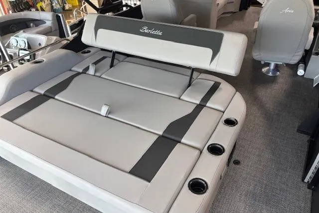 Slide: The Image of 2025 Barletta A22UC boat interior with gray seating and cup holders. - 8