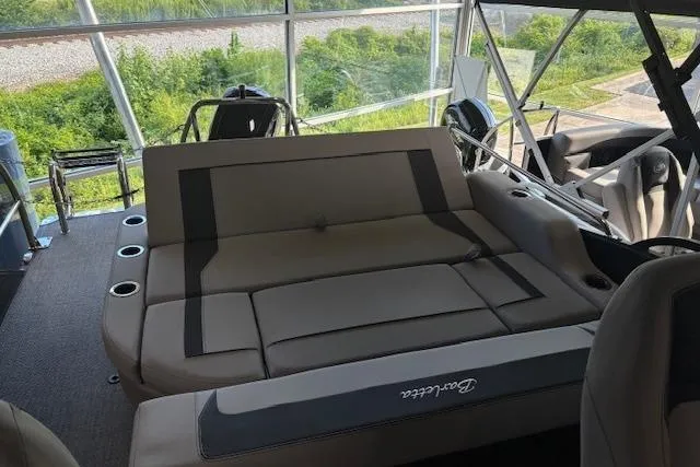 Slide: The Image of 2025 Barletta A22UC boat interior with spacious seating and modern design. - 9