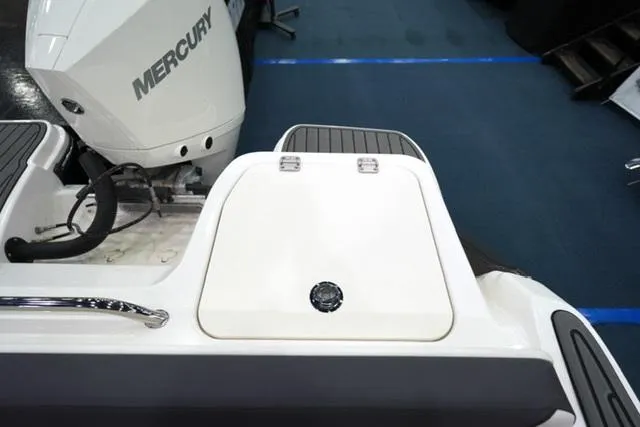 Slide: The Image of 2025 Bayliner T22SC boat with Mercury engine, rear deck view. - 13