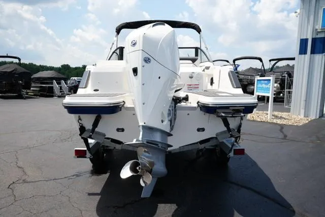 Slide: The Image of 2025 Bayliner T22SC boat, rear view, parked outdoors on a sunny day. - 3
