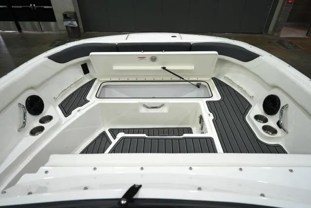 Slide: The Image of 2025 Bayliner T22SC boat interior with sleek seating and storage compartments. - 7