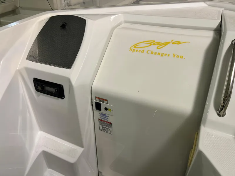 Slide: The Image of 2005 Baja 30 Outlaw boat interior with logo and control panel. - 20