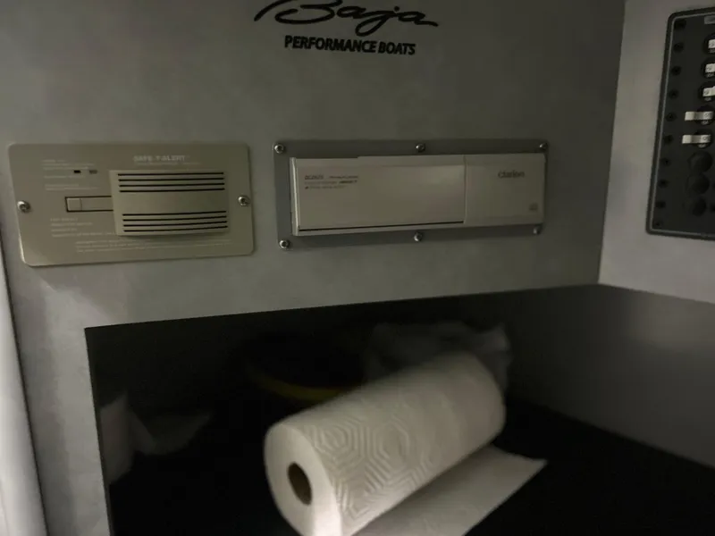 Slide: The Image of 2005 Baja 30 Outlaw interior with control panel and paper towel roll. - 23