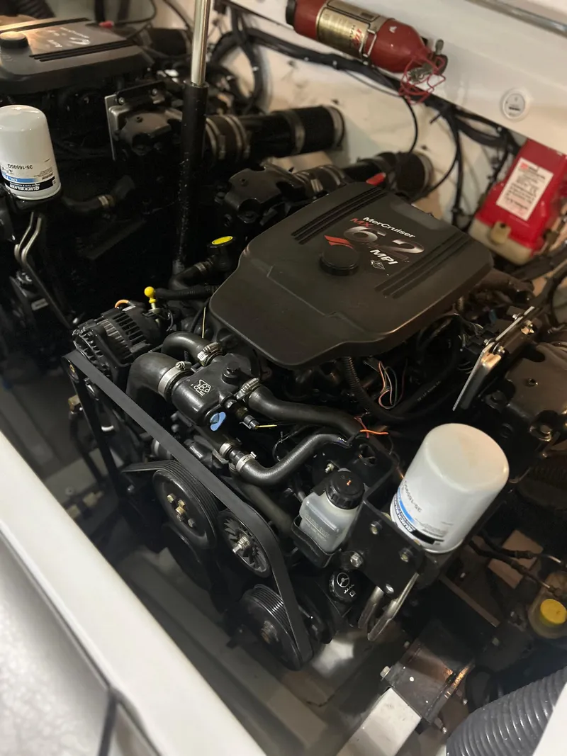 Slide: The Image of 2005 Baja 30 Outlaw engine compartment with visible components and fire extinguisher. - 26