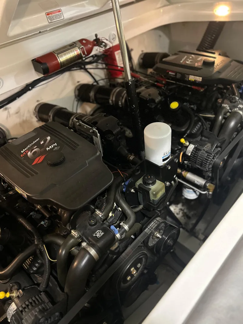 Slide: The Image of 2005 Baja 30 Outlaw engine compartment with dual engines and fire extinguisher. - 27