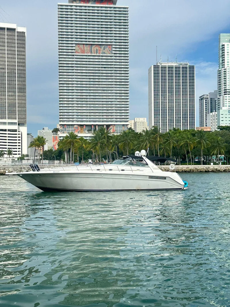 Slide: The Image of 1994 Sea Ray 500 Sundancer yacht on urban waterfront with skyscrapers. - 10