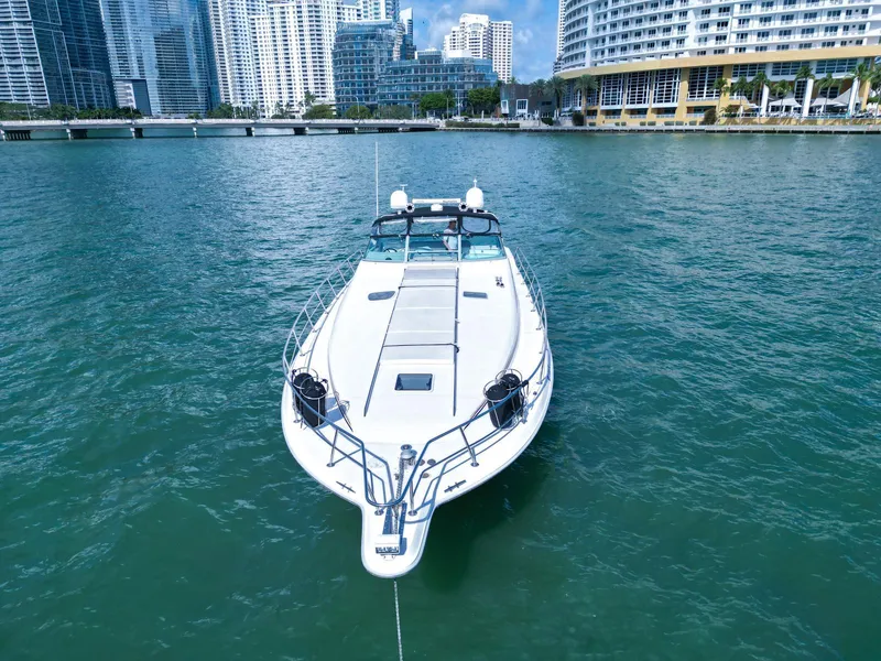 Slide: The Image of Sea Ray 500 Sundancer 1994 yacht docked in urban waterfront setting. - 2