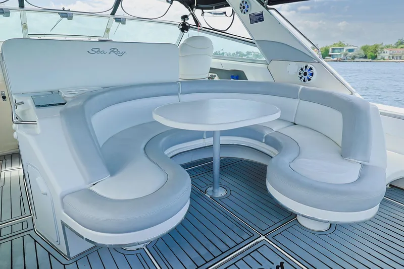 Slide: The Image of Luxurious seating area on 1994 Sea Ray 500 Sundancer yacht with round table. - 21