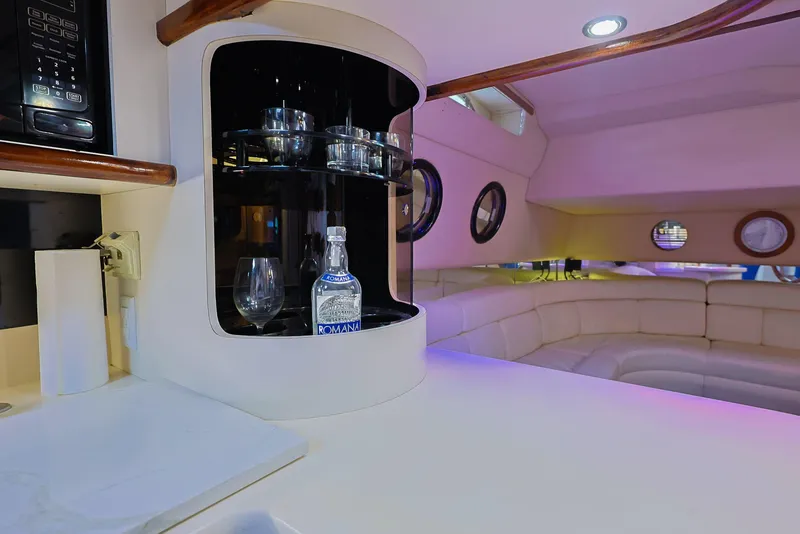 Slide: The Image of Interior of 1994 Sea Ray 500 Sundancer yacht with bar and seating area. - 22