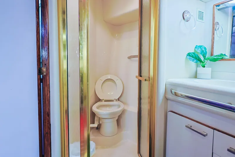 Slide: The Image of Bathroom interior of 1994 Sea Ray 500 Sundancer yacht with shower and toilet. - 23