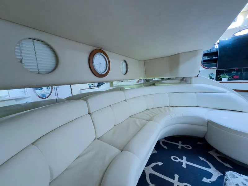 Slide: The Image of Luxurious interior of 1994 Sea Ray 500 Sundancer yacht with plush seating and nautical decor. - 27