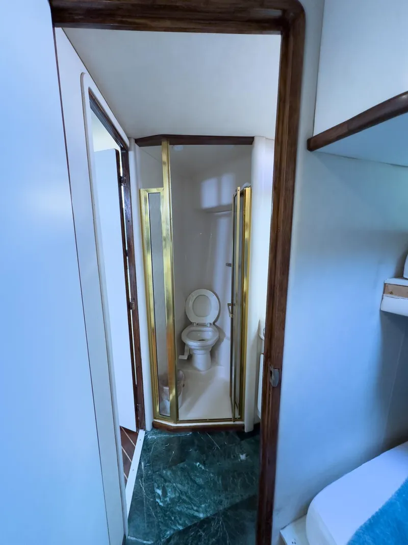 Slide: The Image of Bathroom interior of 1994 Sea Ray 500 Sundancer yacht with shower and toilet. - 30