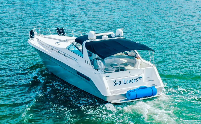 Slide: The Image of 1994 Sea Ray 500 Sundancer yacht cruising on open water. - 5