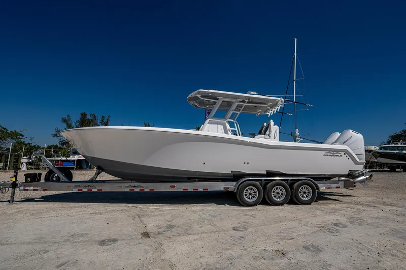 The Image of 2025 Invincible 33 Open Fisherman boat on a trailer, side view. - 0