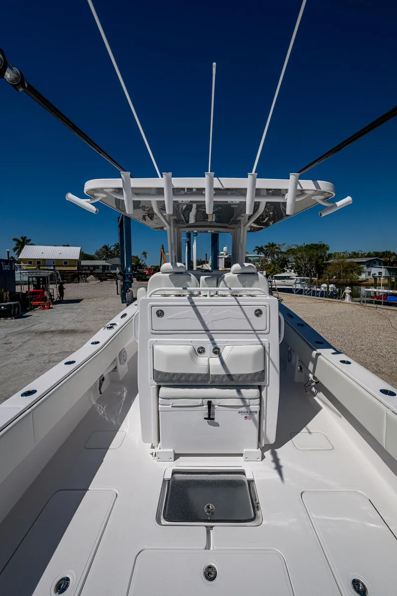 Slide: The Image of 2025 Invincible 33 Open Fisherman boat, sleek design, spacious deck, modern features. - 22