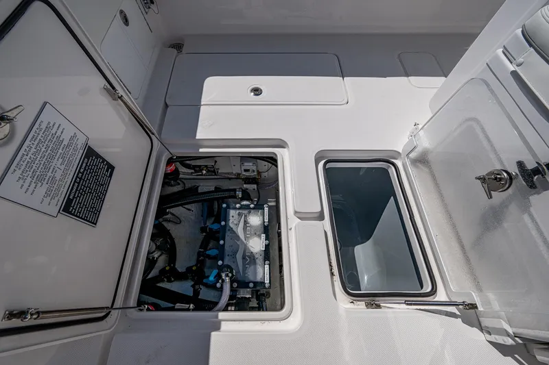 Slide: The Image of 2025 Invincible 33 Open Fisherman deck with open storage compartments. - 23