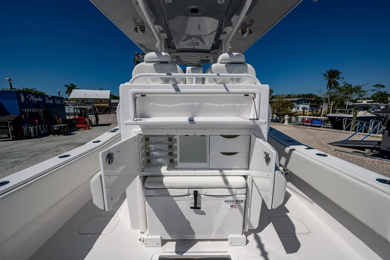 Slide: The Image of 2025 Invincible 33 Open Fisherman boat interior with storage compartments and seating. - 25