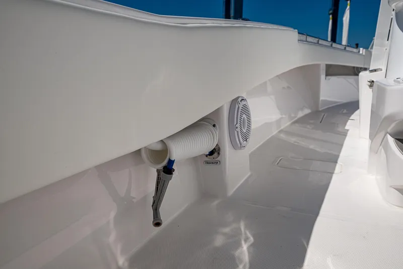 Slide: The Image of 2025 Invincible 33 Open Fisherman boat deck, featuring sleek design and built-in speaker. - 28