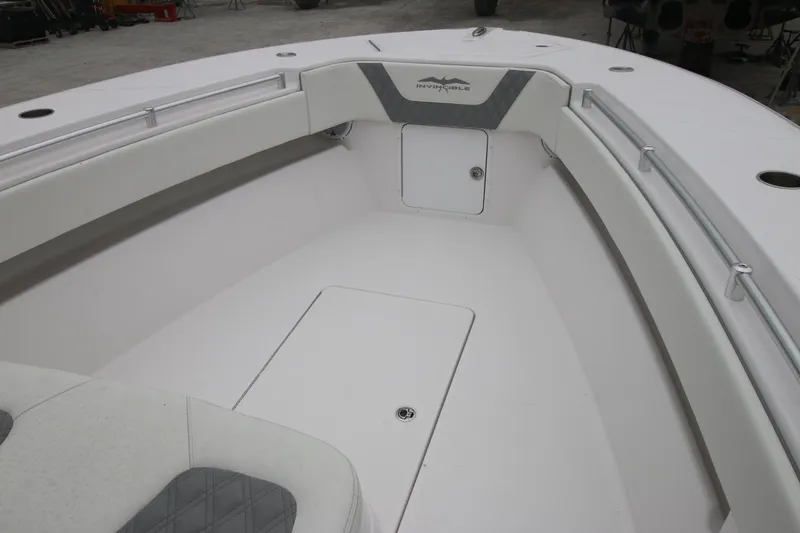 Slide: The Image of 2025 Invincible 33 Open Fisherman boat interior, featuring sleek white seating and storage. - 3