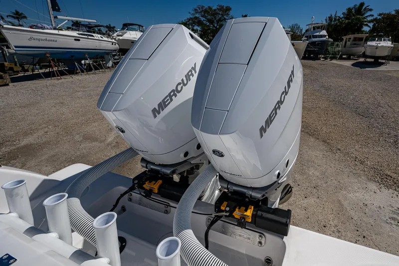 Slide: The Image of Twin Mercury outboard engines on a 2025 Invincible 33 Open Fisherman boat. - 32